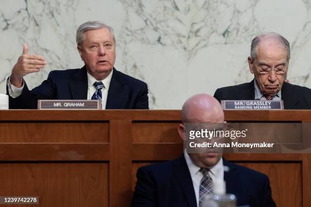 Sen. Lindsey Graham speaks as ranking member Sen. Chuck Grassley looks on during a Senate Judiciary Committee business meeting to vote on Supreme...