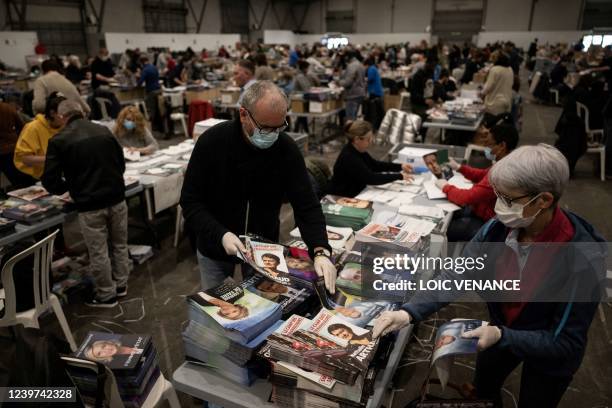 Hundreds of public servants prepare election propaganda to get mailed, less than a week ahead of the first round of the presidential election in...