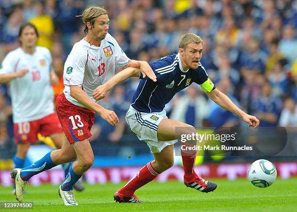 Darren Fletcher of Scotland is challenged by Jaroslav Plasil of Czech Republic during the UEFA EURO 2012 Group I Qualifying match between Scotland...