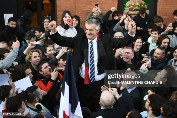 French ruralist party Resistons! presidential candidate Jean Lassalle surrounded by supporters gestures before delivering a speech during a campaign...