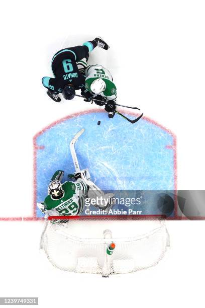 Jake Oettinger of the Dallas Stars and Andrej Sekera of the Dallas Stars defend the net against Ryan Donato of the Seattle Kraken during the second...