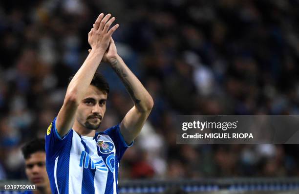 Porto's Portuguese midfielder Fabio Vieira applauds to supporters during the Portuguese League football match between FC Porto and CD Santa Clara at...