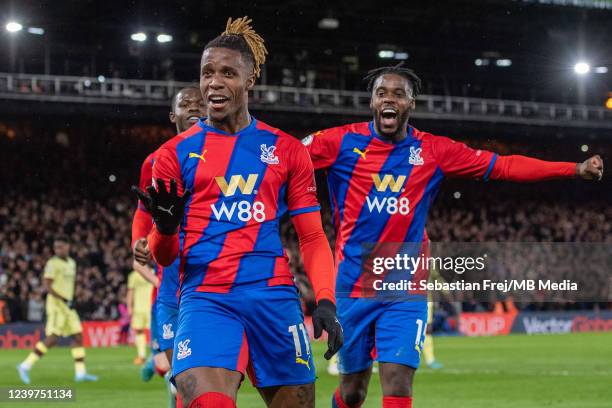 Wilfried Zaha of Crystal Palace celebrates with Jeffrey Schlupp after scoring goal during the Premier League match between Crystal Palace and Arsenal...