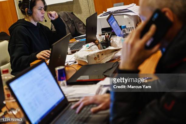 Volunteers work the call centers at the Red Cross in Kharkiv, Ukraine, Thursday, March 24, 2022.