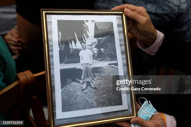 Carolyn Classen, of Tucson, with a photo of ther father Francis Sueo Sugiyama, who was a first year dental student at USC when he fled to Chicago,...