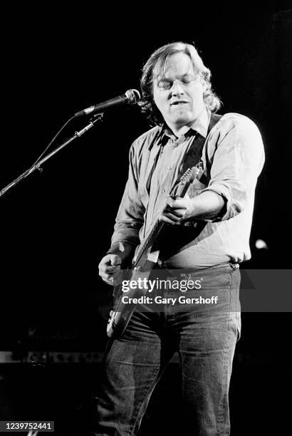 English Rock musician David Gilmour plays guitar as he performs onstage at the Capitol Theatre, Passaic, New Jersey, November 3, 1984. He played...