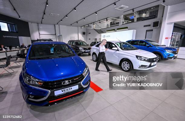 Manager crosses the showroom at a Lada car dealership in Tolyatti, also known as Togliatti, on April 1, 2022. For generations the Russian city of...