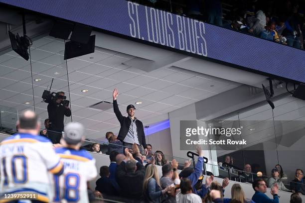 Former St. Louis Blues defenseman Carl Gunnarson acknowledges fans during a game against the Arizona Coyotes at the Enterprise Center on April 4,...