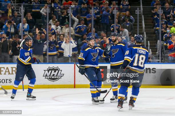 Vladimir Tarasenko of the St. Louis Blues is congratulated by teammates after scoring a goal during the third period against the Arizona Coyotes at...
