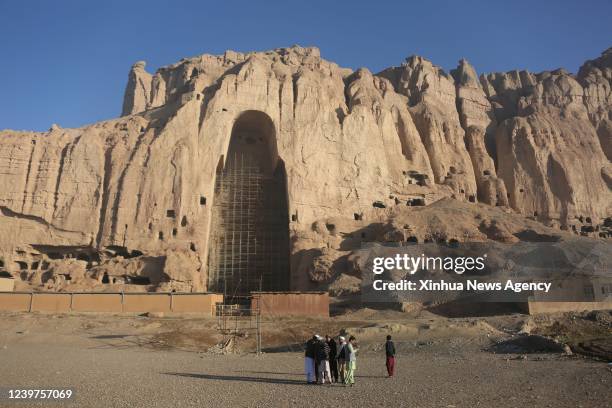 People visit the site of the Bamiyan Buddha statue in Bamiyan, central Afghanistan, March 17, 2022. TO GO WITH "Feature: Afghans want to see giant...