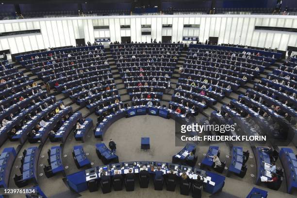 Members of the European Parliament take part in a voting session during a plenary session at the European Parliament in Strasbourg, eastern France,...