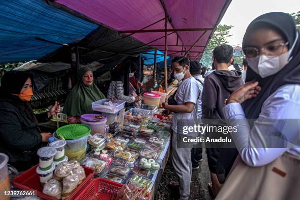 Indonesian Muslims buy food for breaking the fast at a Ramadan market known as Pasar Bedug in Palembang, Indonesia on April 04, 2022. Pasar Bedug is...