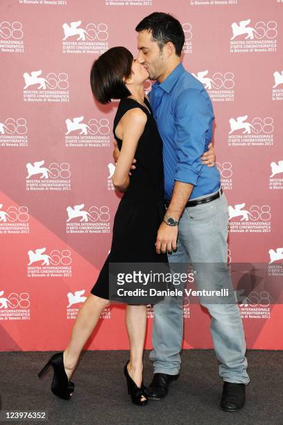 Filippo Timi and Claudia Pandolfi kiss at the "Quando la notte" Photocall during the 68th Venice International Film Festival at Palazzo del Casino on...
