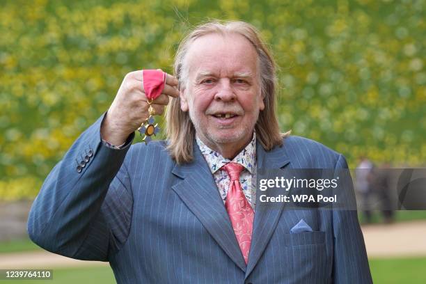 Rick Wakeman holds his CBE medal, awarded by the Princess Royal during an investiture ceremony at Windsor Castle on April 5, 2022 in Windsor, England.