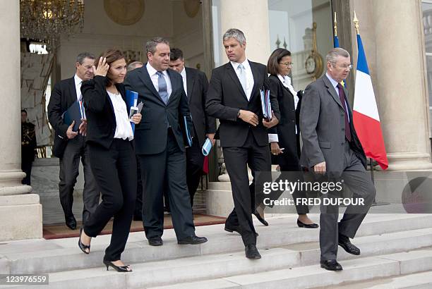 Ministers leave the Elysee presidential palace in Paris, on September 7 following the weekly cabinet meeting. First row, LtoR, Nora Berra, Health...