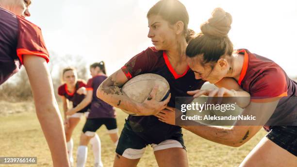 female rugby players in action - kids rugby stock pictures, royalty-free photos & images