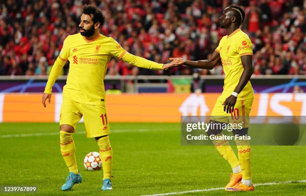 Sadio Mane of Liverpool FC celebrates with teammate Mohamed Salah of Liverpool FC after scoring a goal in action during the Quarter Final Leg One -...