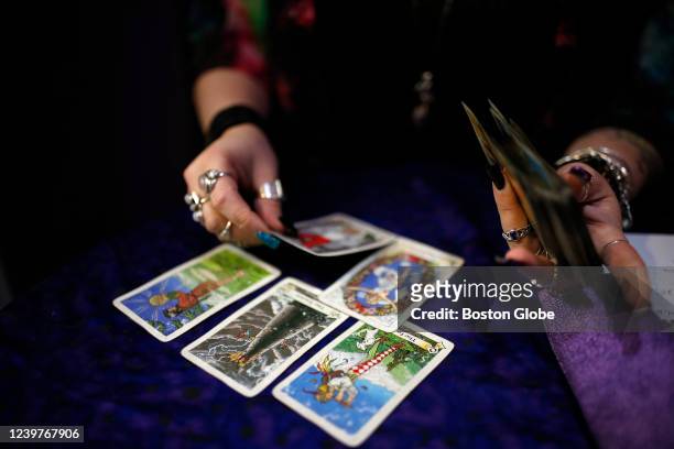 Braintree, MA A person displays her tarot cards at Open Doors in Braintree, MA on March 25, 2022. People have flocked to New Age spiritual...