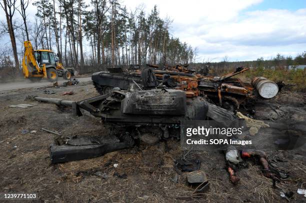 Dead soldier of the Russian army lies near a burnt tank at Dmytrivka village near the Ukrainian capital Kyiv. Russia invaded Ukraine on 24 February...