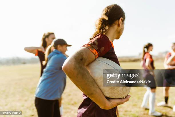 female rugby team and their coach - women rugby stock pictures, royalty-free photos & images