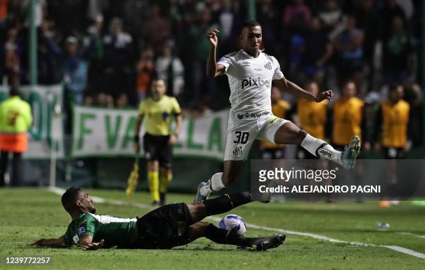 Argentina's Banfield Alejandro Maciel and Brazil's Santos Lucas Braga vie for the ball during their Sudamericana Cup group stage first leg football...