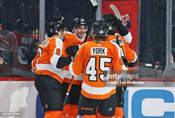 Noah Cates of the Philadelphia Flyers celebrates his first period goal against the Columbus Blue Jackets with Ivan Provorov, Cam York, and Nate...