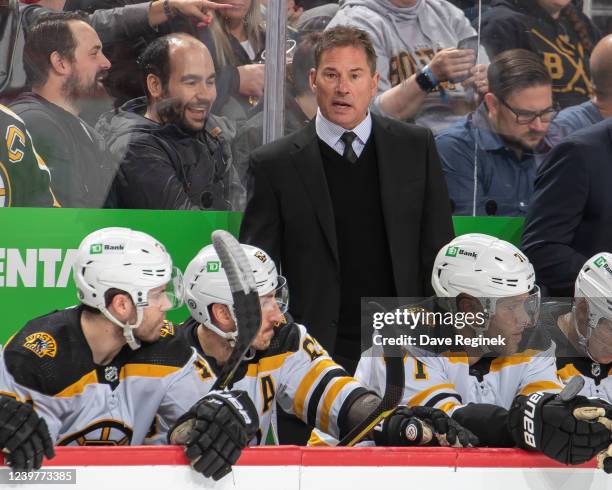 Head Coach Bruce Cassidy of the Boston Bruins looks on from the bench during the first period of an NHL game against the Detroit Red Wings at Little...