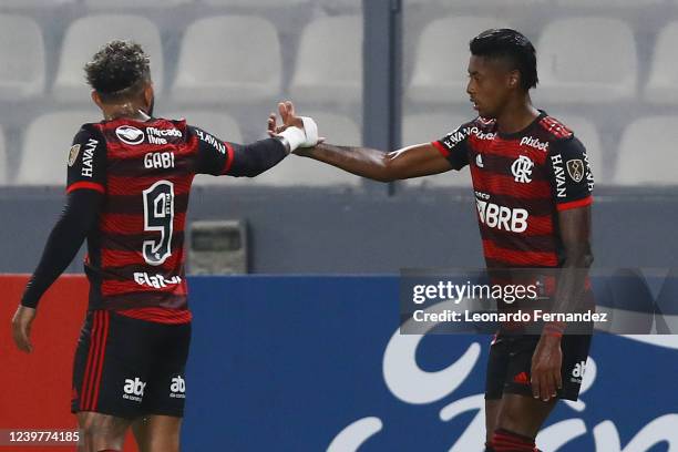 Bruno Henrique of Flamengo celebrates with his teammate Gabriel Barbosa after scoring the first goal for his team during a match between Sporting...