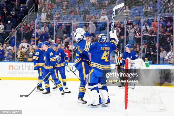 Craig Anderson of the Buffalo Sabres celebrates with Tage Thompson after defeating the Carolina Hurricanes 4-2 in an NHL game on April 5, 2022 at...