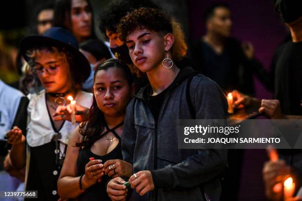 People take part in an homage to remember the victims of hate crimes against the LGBTI community in Medellin, Colombia on April 5, 2022. - Six...