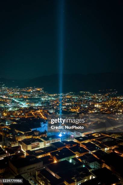 Aerial drone view of a light beam shining during ceremony of 13th anniversary of earthquake in L'Aquila, Italy, on April 5, 2022. The 13th...