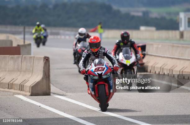 April 2022, Spain, Alcarras: Marc Márquez rides in Alcarras after a practice lap in the pit lane. Honda confirms the release by doctors for the...