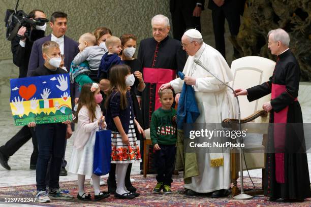 Pope Francis greets children refugees from Ukraine, during his weekly general audience in the Paul VI Hall, at the Vatican, Wednesday, April 6, 2022....