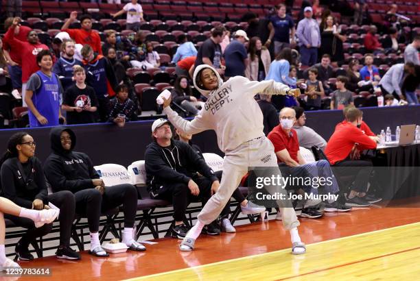 Ja Morant of the Memphis Grizzlies throws a t-shirt to fans during a timeout between the Birmingham Squadron and the Memphis Hustle during an NBA...