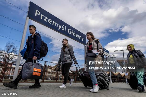 Refugees from Ukraine are seen walking on the platform upon their arrival by train from Odessa at the railway station in Przemysl, southeastern...