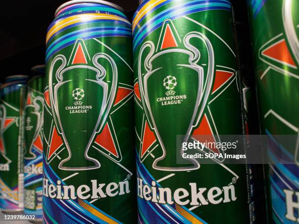 The UEFA Champions League logo seen on Heineken beer cans seen on a supermarket shelf.