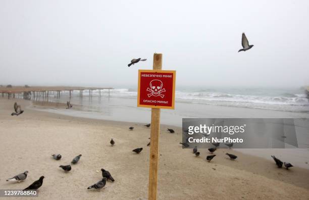&quot;Dangerous mines!&quot; is written on a warning sign at a beach of the city of Odesa, Ukraine on 6 April 2022.