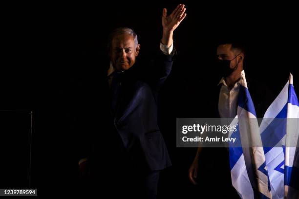 Former Israeli Prime Minister Benjamin Netanyahu greets supporters as he attends a protest against the Israeli government on April 6, 2022 in...