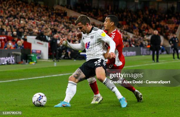 Fulhams Joe Bryan shields the ball from Middlesbrough's Lee Peltier during the Sky Bet Championship match between Middlesbrough and Fulham at...