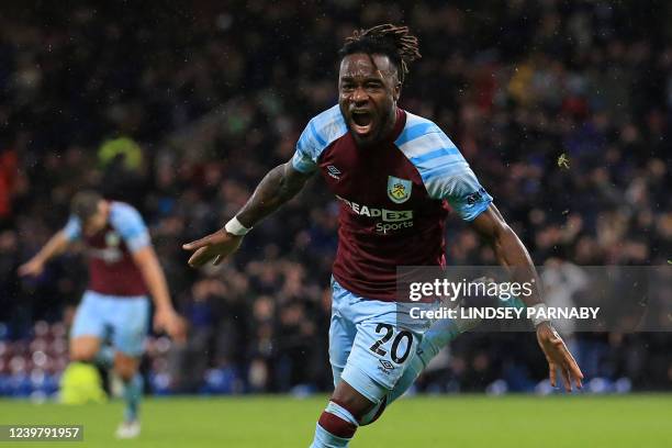 Burnley's Ivorian defender Maxwel Cornet celebrates after scoring there third goal during the English Premier League football match between Burnley...