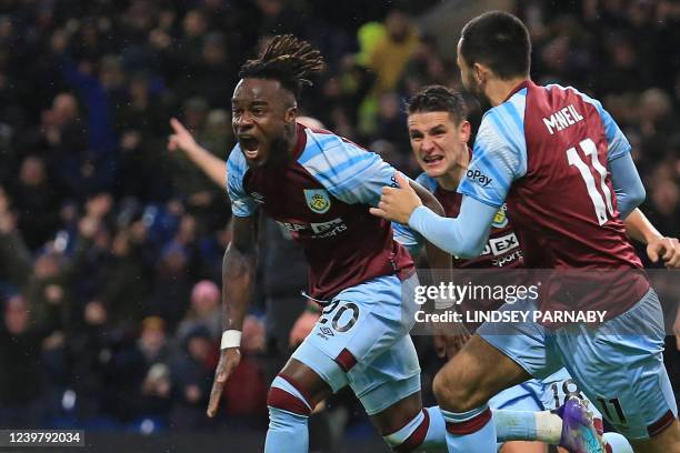 Burnley's Ivorian defender Maxwel Cornet celebrates after scoring there third goal during the English Premier League football match between Burnley...
