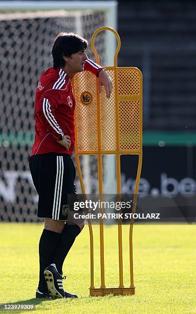Germany's coach Joachim Loew looks on during a training session in Cologne, western Germany, on September 5, 2010. The German national football team...