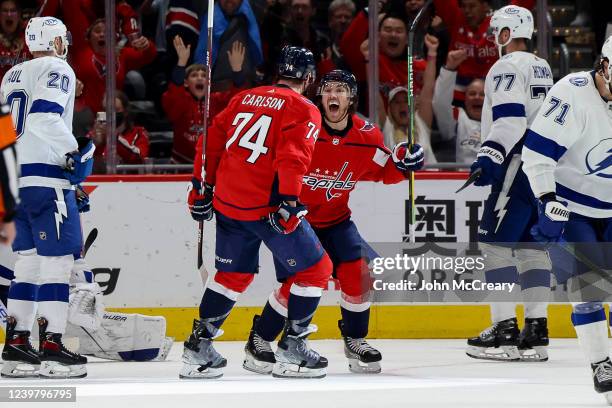 Oshie of the Washington Capitals celebrates with John Carlson as he scores his second goal of the game during a against the Tampa Bay Lightning at...