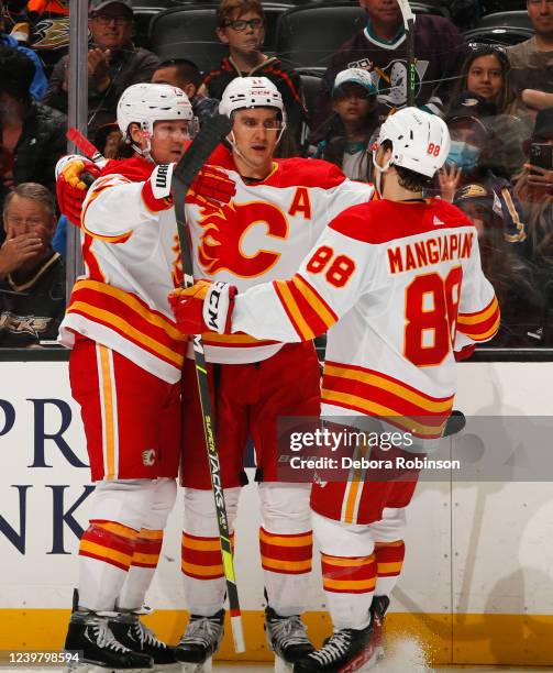 Tyler Toffoli of the Calgary Flames celebrates his goal with teammates during the second period against the Anaheim Ducks at Honda Center on April 6,...