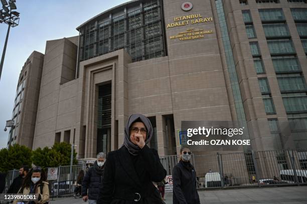 Hatice Cengiz, the fiancee of murdered Saudi critic Jamal Khashoggi, walks towards waiting journalists outside the courthouse, after they confirmed a...