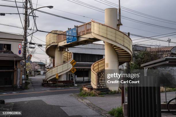 Footbridge straddles a narrow road on April 7, 2022 near Futtsu, Japan.