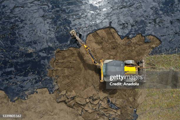 An aerial view of the pitch leaked area from the pool at asphalt construction site during the cleaning works in Edirne, Turkiye on April 7, 2022.