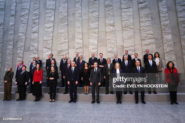 Secretary of State Antony Blinken and NATO Secretary-General Jens Stoltenberg pose for a family photo following a NATO foreign ministers meeting,...