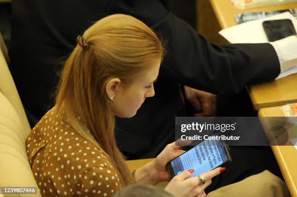 Russian State Duma Deputy Maria Butina reads an article about sanctions during the session of the Duma on April 7, 2022 in Moscow, Russia. Russia's...