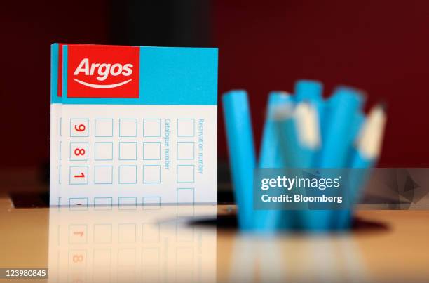 Product order forms and pencils sit on display at an Argos store, operated by Home Retail Group Plc, in Enfield, U.K. On Wednesday, Sept. 7, 2011....